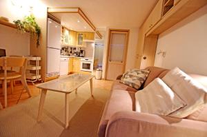 a living room with a couch and a table at Résidence Palafour - Studio 4 rénové, confort moderne - balcon vue lac MAE-8175 in Tignes +22 photos