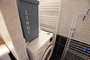 a laundry room with a washer and dryer in it at Résidence Palafour - Studio 4 rénové, confort moderne - balcon vue lac MAE-8175 in Tignes