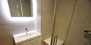 a bathroom with a shower and a sink and a mirror at Résidence Grand Tichot B - 4 pièces 80m2 - Au coeur du Val Claret MAE-2314 in Tignes +19 photos