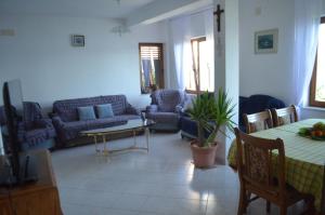 a living room with a couch and a table at Holiday Villa in Omiš in Omiš