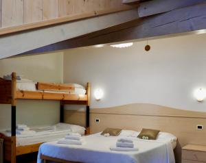 Ένα ή περισσότερα κρεβάτια σε δωμάτιο στο Hotel Garnì Maffei