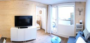 Televízia a/alebo spoločenská miestnosť v ubytovaní Résidence Hameau Du Borsat 1& 2 - Studio 22 m² entièrement rénové MAE-7544