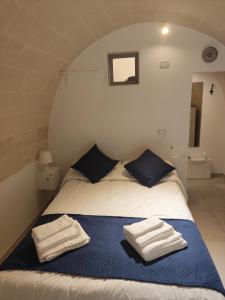 Postel nebo postele na pokoji v ubytování La Casaredda Guesthouse, 69-71