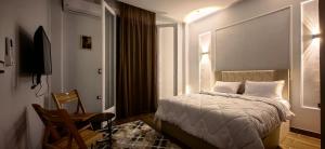 Postel nebo postele na pokoji v ubytování La Casa Del Rey Downtown Cairo + 23 fotografií