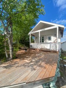 a home with a deck and a house at Sara's cabins-hytter in Kautokeino
