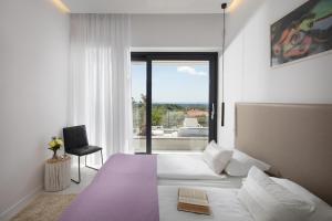 Postelja oz. postelje v sobi nastanitve Villa Astera