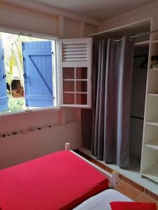 Postel nebo postele na pokoji v ubytování Villa Pakala au Diamant-jolie villa avec piscine et jardin