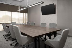 a conference room with a wooden table and chairs at Springhill Suites by Marriott Lexington Fritz Farm in Lexington +21 photos