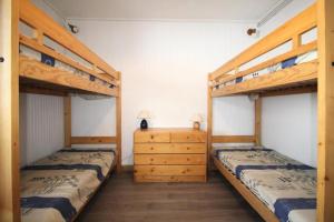 Posteľ alebo postele v izbe v ubytovaní Le Pramecou - Dans une residence calme a proximité des pistes MAE-5024