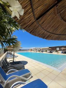 Πισίνα στο ή κοντά στο Villa 4 à 6 personnes dans résidence avec piscines proche plage