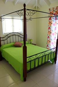 Letto o letti in una camera di CAS IGUANA - Curacao - Villapark Fontein - Ferienhaus mit Pool