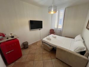 TV a/nebo společenská místnost v ubytování Residenza Catullo