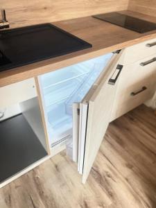 an open drawer in a wooden desk with a drawer at Résidence Hameaux Ii - Studio rénové 3 personnes - Plagne Village MAE-7324 in Aime La Plagne