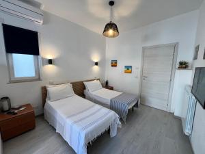 Postel nebo postele na pokoji v ubytování DMC - Alloggio Turistico