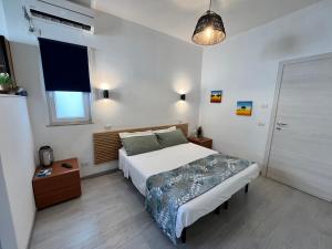Postel nebo postele na pokoji v ubytování DMC - Alloggio Turistico