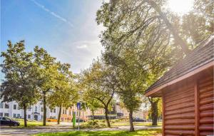 a view of a street with trees and a building at Beautiful Apartment In Zielona Góra in Zielona Góra