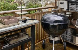 a large pot sitting on a grill on a deck at 3 Bedroom Awesome Home In Vallda in Vallda