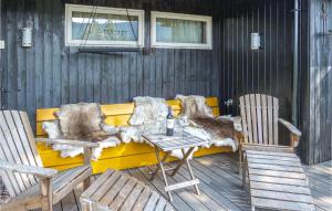 a table and two chairs on a deck with a table and chairs at Lovely Home In Hemsedal With Sauna in Hemsedal
