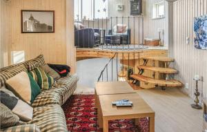 a living room with a couch and a table at Lovely Home In Hemsedal With Sauna in Hemsedal