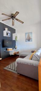 a bedroom with a bed and a ceiling fan at El retiro azul in Gáldar +46 photos