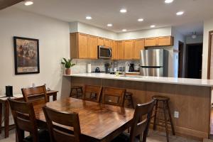 a kitchen with a wooden table and a kitchen counter at St John C in Jackson