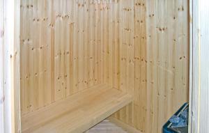 a wooden sauna with a wooden bench in it at Holiday Home Gålå Peer Gyntlia Iv in Gålå