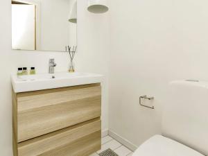 a bathroom with a sink and a toilet at 4 star holiday home in Hals-By Traum in Hals +48 photos
