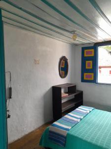 Postel nebo postele na pokoji v ubytování Hostal Familiar Jerico