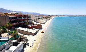 a view of a beach with buildings and the ocean at Magnificent Beach side home with WiFi Jerry`s condo #1 in San Felipe
