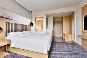 Letto o letti in una camera di Four Points by Sheraton Kochi Infopark