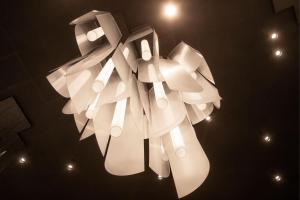 a white light hanging from a ceiling with lights at The Westin Las Vegas Hotel & Spa in Las Vegas