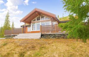 a large wooden house on top of a hill at 3 Bedroom Amazing Home In Meråker in Meråker