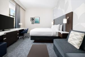 a hotel room with a bed and a desk at Residence Inn by Marriott New York Downtown Manhattan/World Trade Center Area in New York