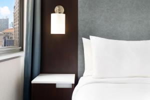 a hotel room with a bed and a window at Residence Inn by Marriott New York Downtown Manhattan/World Trade Center Area in New York