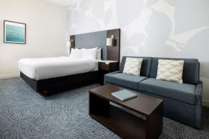 a hotel room with a bed and a couch at Residence Inn by Marriott New York Downtown Manhattan/World Trade Center Area in New York