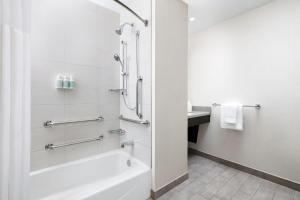 a bathroom with a tub and a sink at Residence Inn by Marriott New York Downtown Manhattan/World Trade Center Area in New York