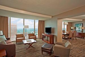 a hotel room with a view of a living room at The Westin Peachtree Plaza, Atlanta in Atlanta