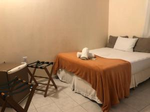 Postel nebo postele na pokoji v ubytování Morro de São Paulo Hospedagens