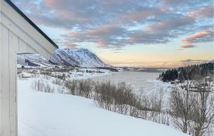 a view of a river in the snow from a house at Amazing Home In Stamsund With Kitchen in Stamsund
