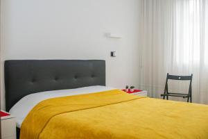 Postel nebo postele na pokoji v ubytování Stanza tecnologica