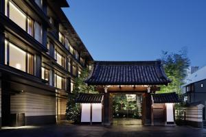 an entrance to a building with an asian gate at HOTEL THE MITSUI KYOTO, a Luxury Collection Hotel & Spa in Kyoto