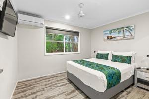 Giường trong phòng chung tại Comfort Resort Blue Pacific +91 ảnh