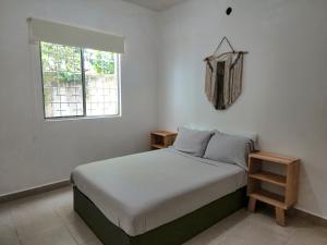 Ένα ή περισσότερα κρεβάτια σε δωμάτιο στο El Faro 2bed 1 bath gated neighborhood with pool