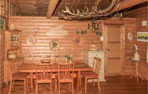 a dining room with a wooden table and chairs at 2 Bedroom Beautiful Home In Balestrand in Balestrand
