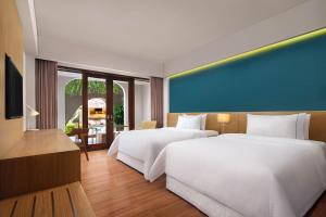 Postel nebo postele na pokoji v ubytování Element Bali Ubud