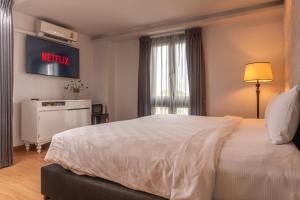 Postel nebo postele na pokoji v ubytování A.LIST HOTEL