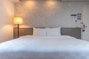 Postel nebo postele na pokoji v ubytování A.LIST HOTEL