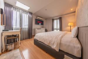 Postel nebo postele na pokoji v ubytování A.LIST HOTEL + 37 fotografií