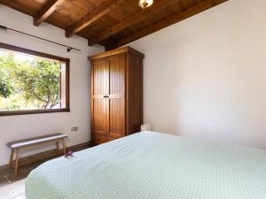 Posteľ alebo postele v izbe v ubytovaní Casa rural con piscina climatizada y jardín en Icod de los Vinos - ES-279-18