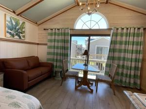 a living room with a couch and a table at NC 12 56821-37 Condo in Hatteras